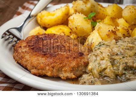 Delicious Meal Of Minced Meat Cutlet, Potatoes And Fried Cabbage.