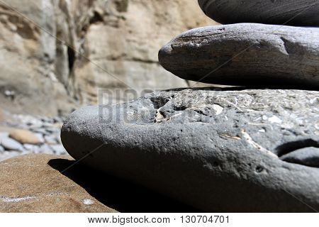 A sculptured cairn made from fossilized stones highlighting shells embedded within
