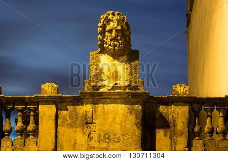 Sculpture of a Roman river god in city of Bath. A bust from 1837 displayed above a building in the UNESCO world heritage city of Bath UK