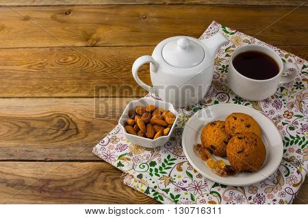 Teapot and homemade cookies. Sweet dessert. Breakfast cookies. Sweet pastry. Cup of tea. Tea cup. Breakfast tea. Homemade biscuit. Homemade cookies.
