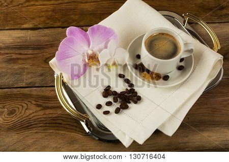 Coffee cup served on the serving tray. Coffee cup. Cup of coffee. Strong coffee. Coffee mug. Morning coffee. Coffee break.