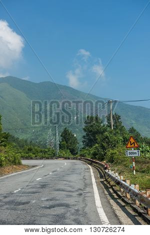 Highway enroute Kim Lien in Vietnam. The mountainous road has some jaw-dropping beauty and offers smooth ride to famous Kim Lien village. The clear blue sky looks dazzling.