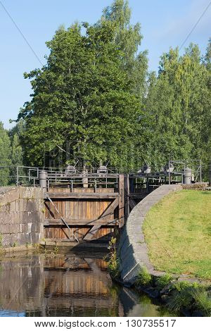 Ancient wooden gate of the old lock 