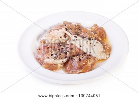 Raw Marinated Chicken With Black Pepper Isolated On White