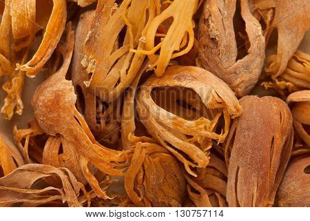 Organic Indian Javitri or Mace (Myristica Fragrans). Macro close up background texture. Top view.