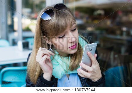 Young Woman Making Self Portrait Using Smartphone