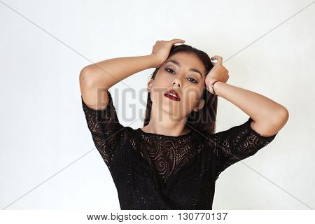 Beautiful stylish girl holding his head on white background