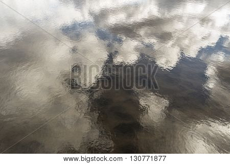 Beautiful white clouds reflected in the lake.