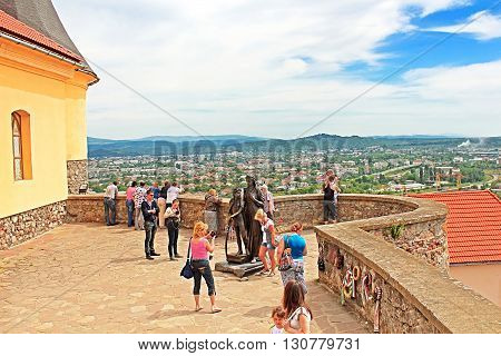 MUKACHEVE, UKRAINE - MAY 10, 2013: Unidentified people in Palanok Castle or Mukachevo Castle, Zakarpattya, Ukraine, built in 14th century. The Palanok Castle is delicately preserved and is located on a former 68 metre high volcanic hill