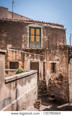 Old houses in a small town on the coast of Sicily