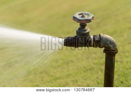 Closeup Of Water Running From Outdoor Park