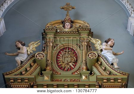 ZAGREB, CROATIA - SEPTEMBER 14: IHS sign on the altar in the Basilica of the Sacred Heart of Jesus in Zagreb, Croatia on September 14, 2015