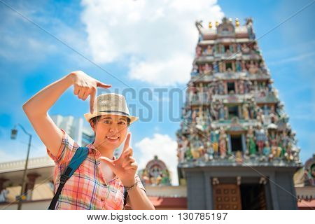 Happy Young Woman Framing In Sri Mariamman Temple, Singapore