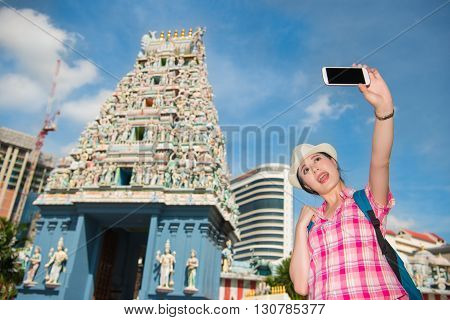 Smiling Young Woman Making Selfie Near Sri Mariamman Temple, Singapore