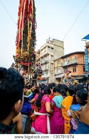 PATAN, NEPAL - MAY 19, 2016: God of rain Rato Machhindranath chariot festival. Rato Machhindranath is worshiped as the god of rain. The chariot is pulled through the street of Patan for about a month.