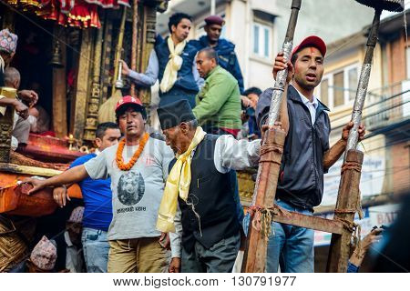 PATAN, NEPAL - MAY 19, 2016: God of rain Rato Machhindranath chariot festival. Rato Machhindranath is worshiped as the god of rain. The chariot is pulled through the street of Patan for about a month.