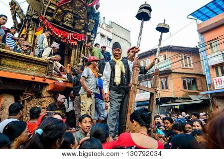 PATAN, NEPAL - MAY 19, 2016: God of rain Rato Machhindranath chariot festival. Rato Machhindranath is worshiped as the god of rain. The chariot is pulled through the street of Patan for about a month.