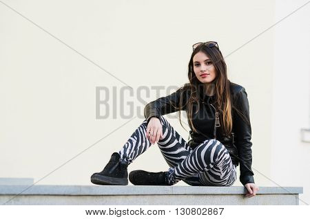Portrait of a pretty woman sitting outdoors