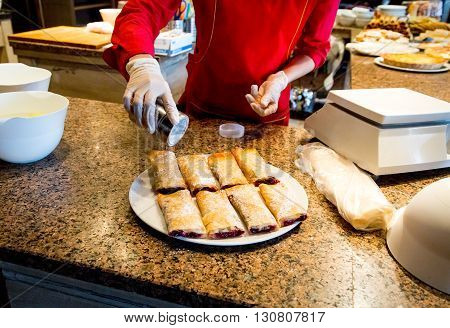 cooking sweet strudel with berries in a cafe