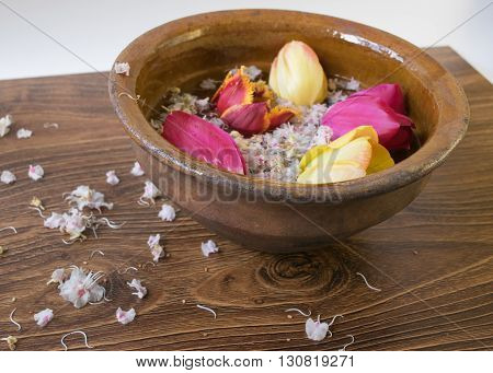 Old Bowl With Flowers Tulips On The Wooden Table