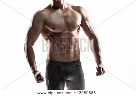 Close-up strong bodybuilder man posing with perfect abs, houlders, biceps, triceps and chest. Isolated on white background Whith solar flare