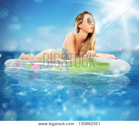 Sunbathe on an airbed in the sea