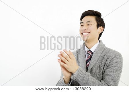 Asian young business man is clapping his hands