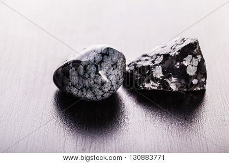 Obsidian Stones On Wood
