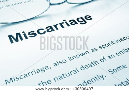 Miscarriage sign on a paper and glasses.