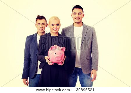 Business team-two men and woman holding piggybank