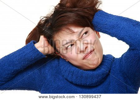 studio shot of demented woman on white background