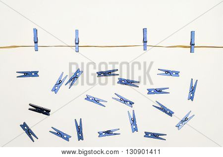 composition with clothes pegs and a fake sun and sky
