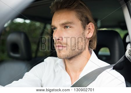 Portrait of a man driving his car