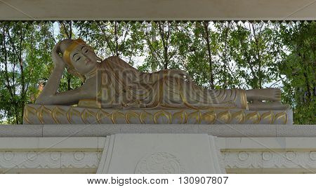 reclining buddha statue in mendut buddhist monastery