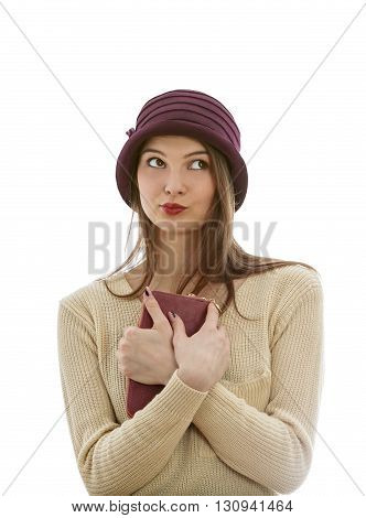 Portrait of a young wman with a wallet looking up left isolated against a white background.