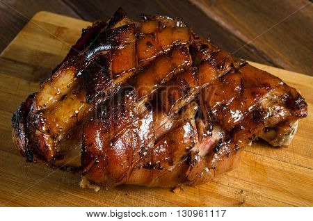 Roasted pork knuckle on the wooden table