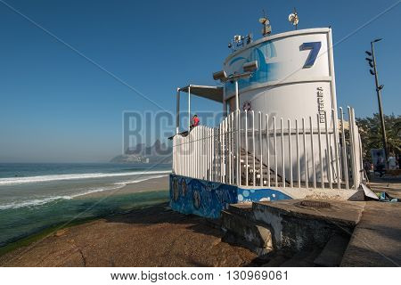 RIO DE JANEIRO, BRAZIL - MAY 7, 2016: Lifeguard post 7 stands on the rock in Arpoador beach.