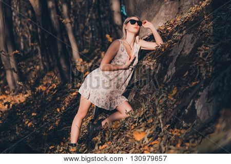 Sexy girl in the woods beauty style fashion