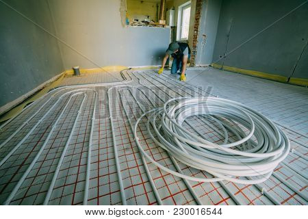Pipefitter installing system of heating. Repair in the apartment
