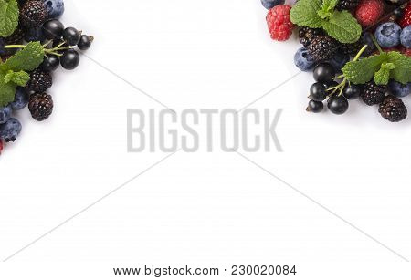 Fruits And Berries On White Background. Ripe Black Currants, Blackberries, Bluberries, And Raspberri