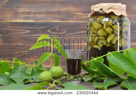 Preparing Green Walnut Liqueur Nocino, Horizontal Image