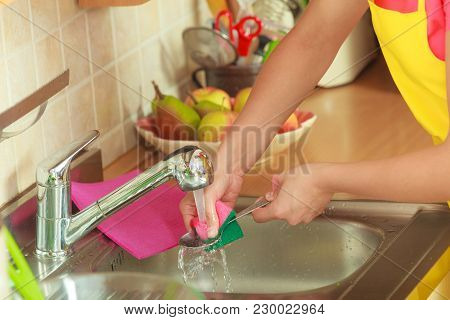 Household. Closeup Woman Doing The Washing Up In Kitchen
