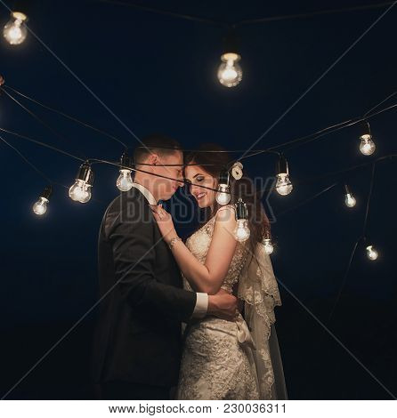 Wedding Couple In Magical Night Forest Decorated Light Garlands