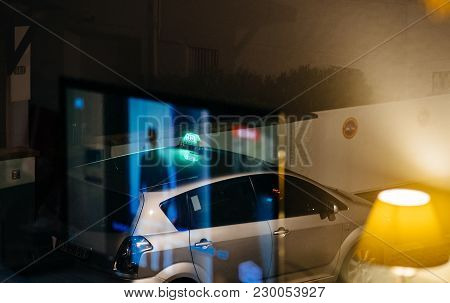 Paris, France - Jan 6, 2018: Abstract Double Reflection Of The Window And The Parked Taxi Waiting Fo