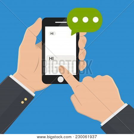 Chat Message On The Smartphone Screen. Hand Holds The Smartphone, Finger Touches Screen. The Modern 