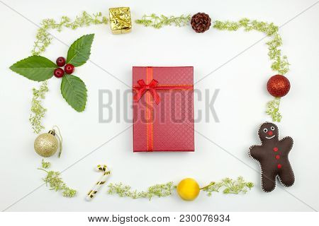 A Red Gift Box With Christmas Decoration Frame. Flat Lay Christmas Concept.