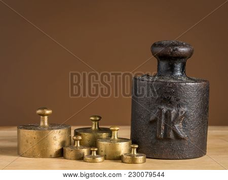 Old Iron 1Kg Weight And Smaller Brass Weights For A Kitchen Scale