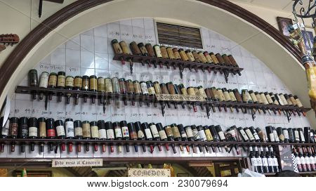 Almeria, Spain - February 9, 2018: Large Collection Of Vintage Wine Botteles In City Centre Bar