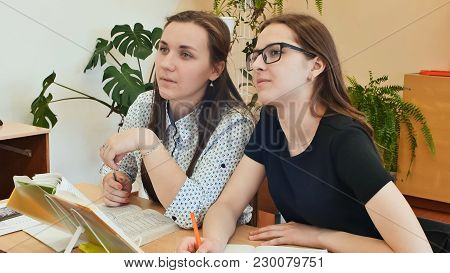 Students Study In The Classroom At The School Desk.
