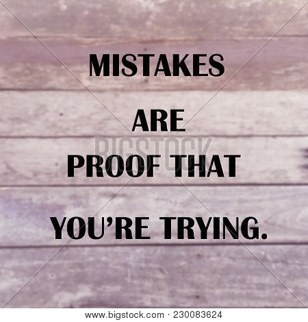 Inspirational Quote “mistakes Are Proof That You’re Trying” On Blurred Wood Planks Background